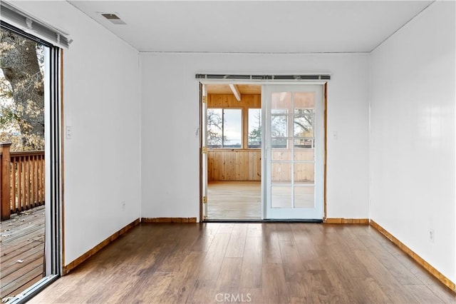 empty room featuring wood-type flooring