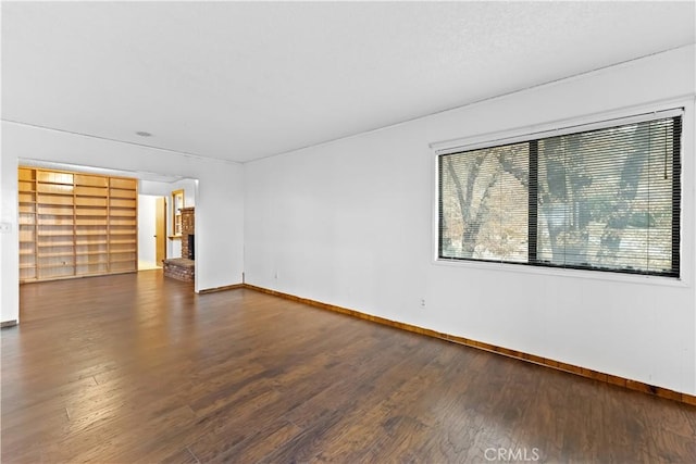 spare room featuring dark hardwood / wood-style floors