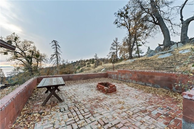 view of patio with an outdoor fire pit