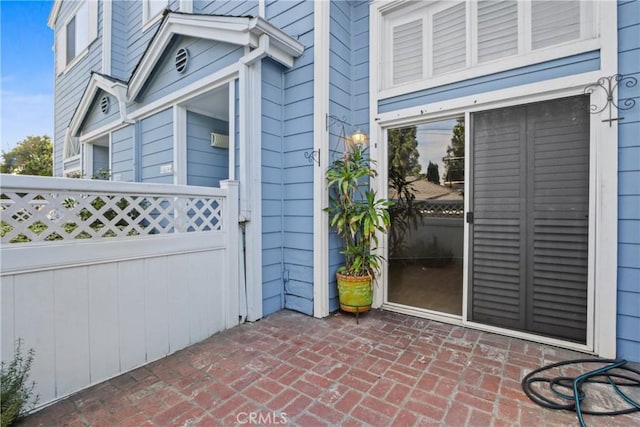 entrance to property featuring a patio area