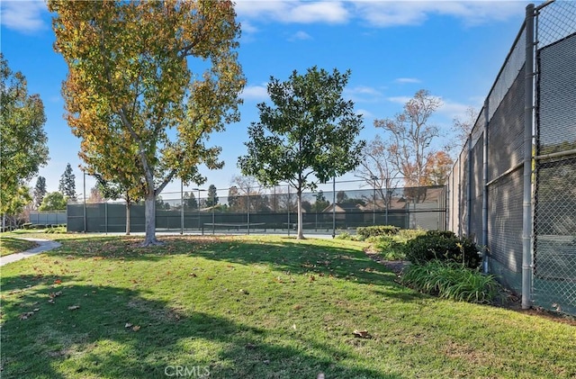 view of yard with tennis court