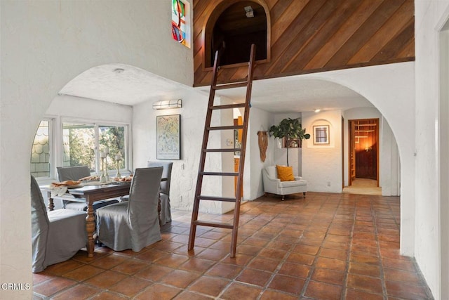 dining area featuring arched walkways