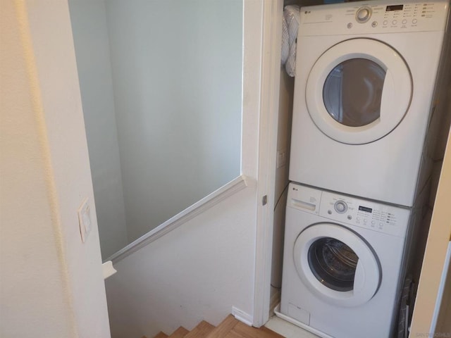 laundry area featuring stacked washer / dryer