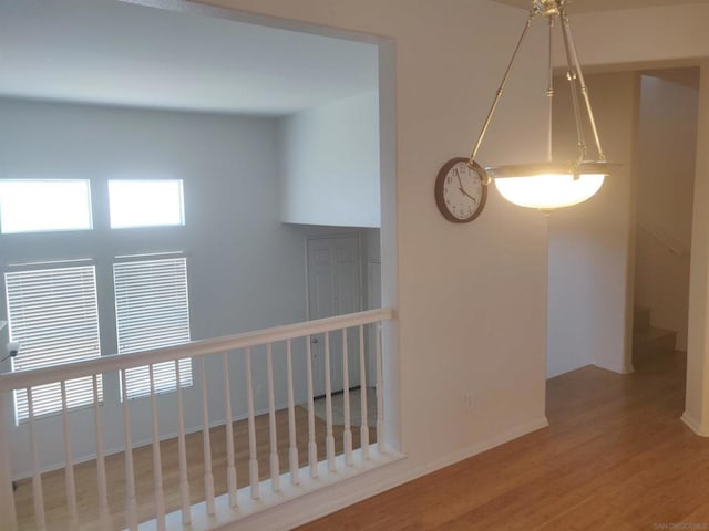 hall with hardwood / wood-style flooring