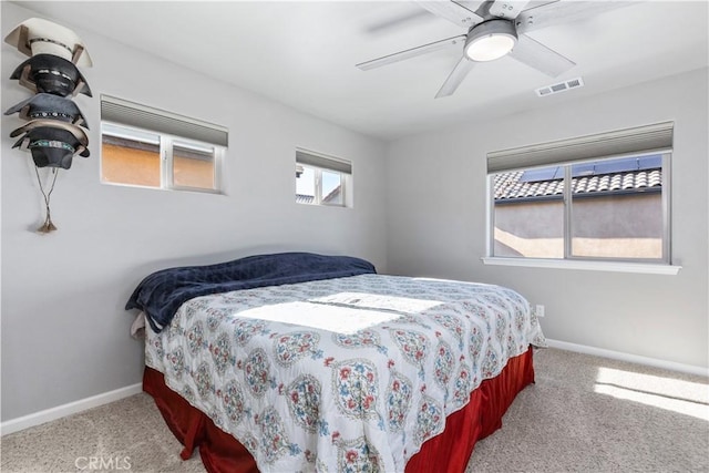 bedroom with light carpet and ceiling fan