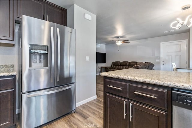 kitchen featuring ceiling fan, dark brown cabinets, stainless steel appliances, and light hardwood / wood-style floors