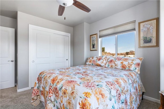 bedroom featuring ceiling fan, carpet floors, and a closet