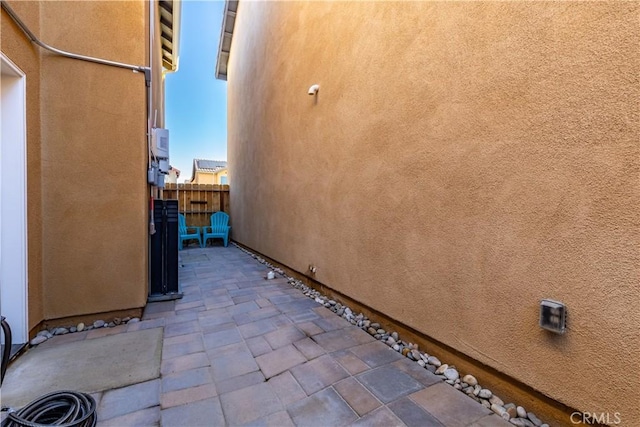 view of side of home with a patio