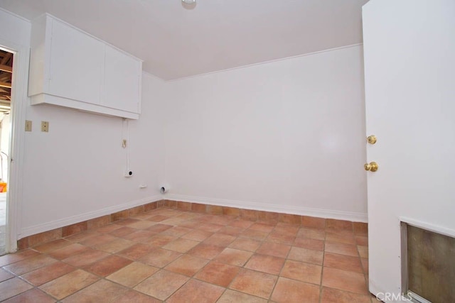 laundry area with cabinets