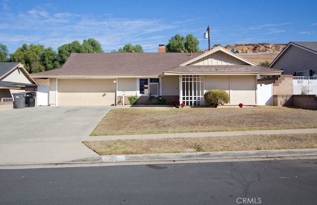 ranch-style house featuring a garage