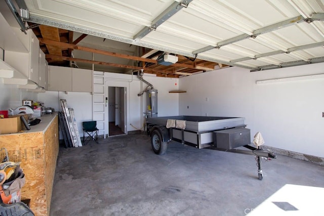 garage with a garage door opener and water heater