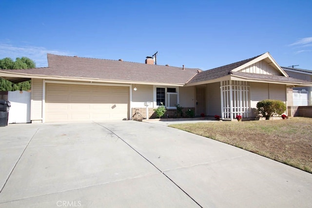 single story home featuring a front yard and a garage