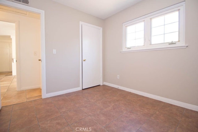 unfurnished bedroom featuring tile patterned floors