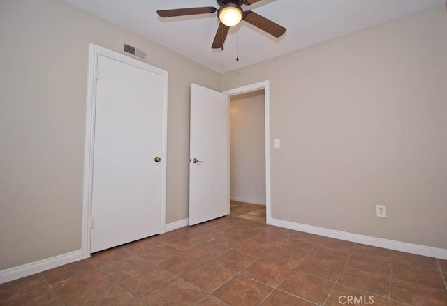 unfurnished bedroom featuring ceiling fan