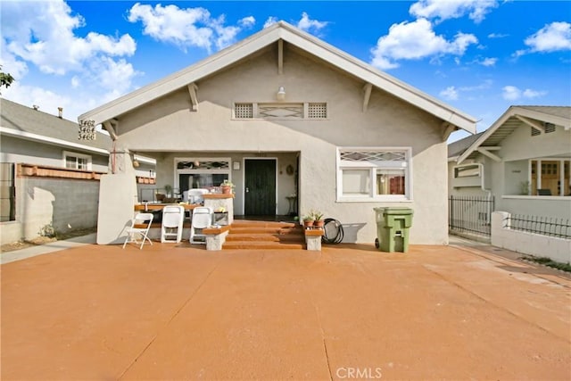 rear view of property featuring a patio area