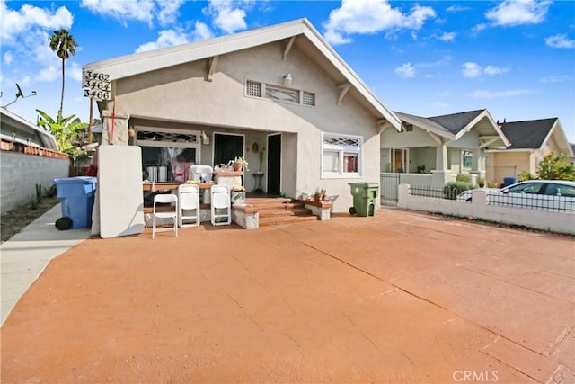 rear view of property with a patio