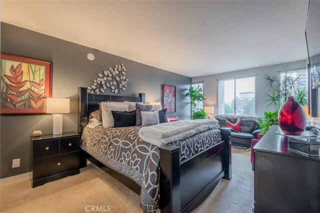 bedroom with light colored carpet