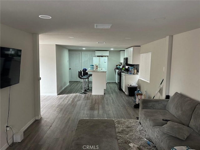 living room featuring dark hardwood / wood-style floors