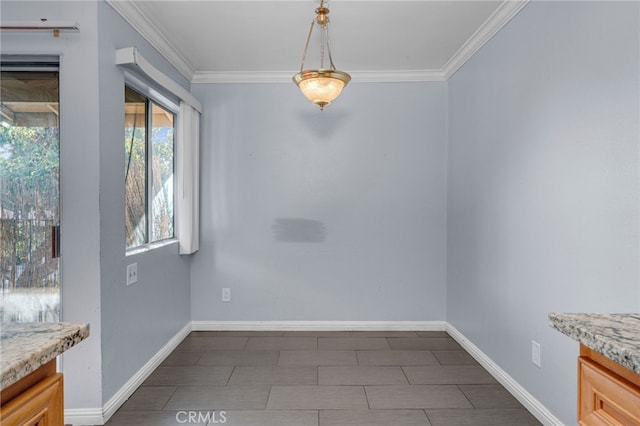 unfurnished dining area with crown molding