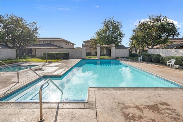 view of swimming pool with a patio area