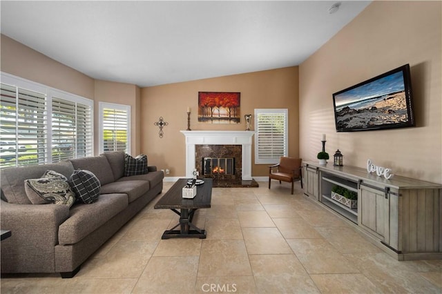 tiled living room with a fireplace and lofted ceiling