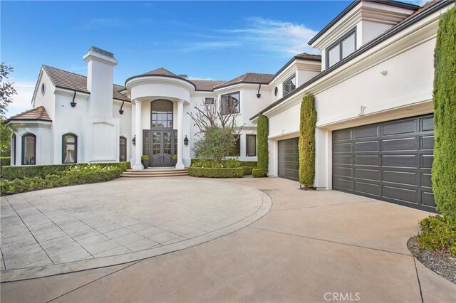 1 Moss Lndg, Laguna Niguel, CA 92677 - view of front of property featuring stucco siding, driveway, and french doors