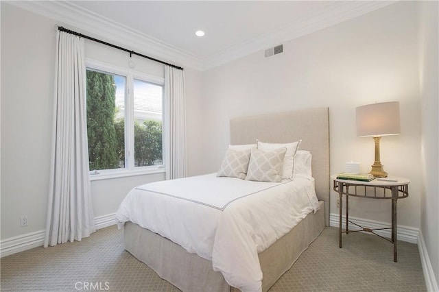 carpeted bedroom with crown molding