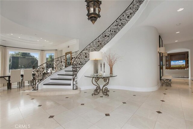 1 Moss Lndg, Laguna Niguel, CA 92677 - staircase featuring recessed lighting, tile patterned floors, ornamental molding, and arched walkways