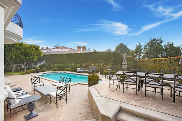 view of pool with a patio