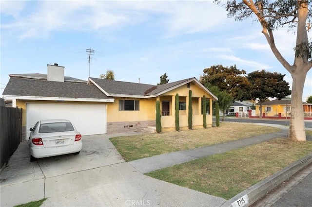 single story home with a garage and a front lawn