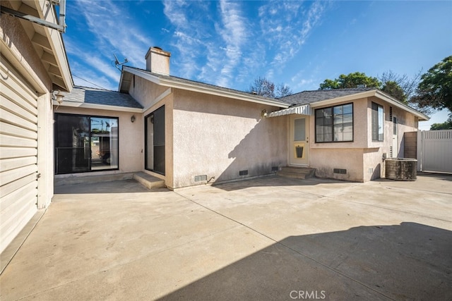 back of property with a patio and central AC unit