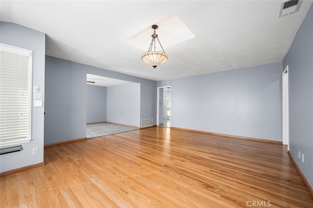 unfurnished room featuring light hardwood / wood-style floors