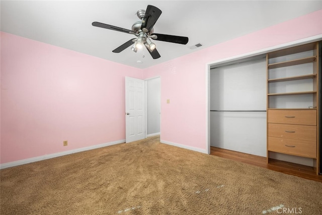 unfurnished bedroom featuring carpet floors, a closet, and ceiling fan