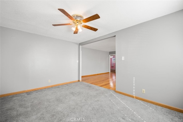 spare room with wood-type flooring and ceiling fan