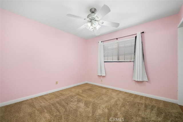 spare room with ceiling fan and carpet floors