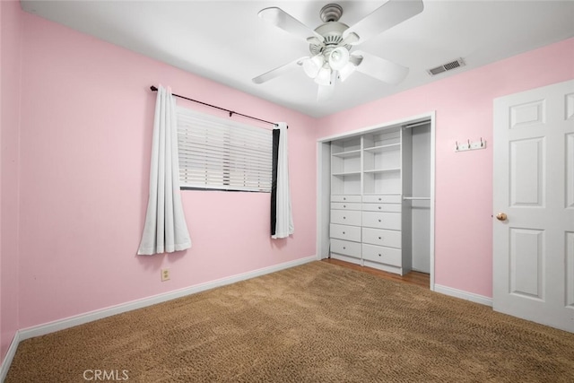 unfurnished bedroom with ceiling fan, a closet, and carpet