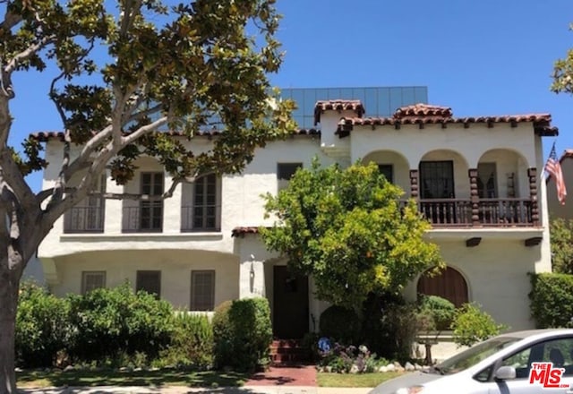 mediterranean / spanish-style house with a balcony