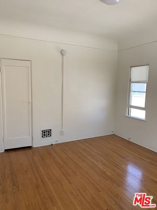 empty room featuring hardwood / wood-style floors