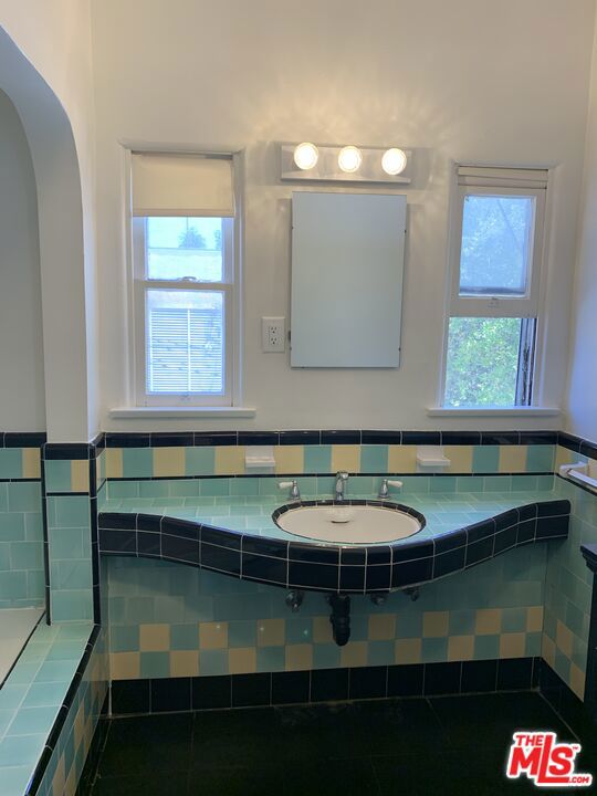 bathroom with tile patterned floors