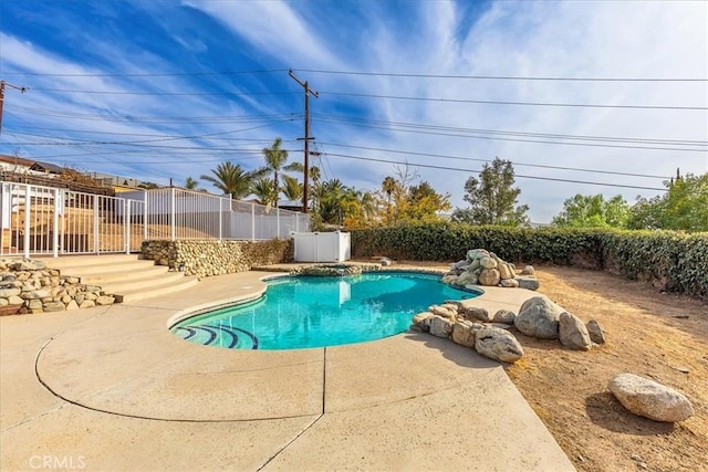 view of swimming pool with a patio