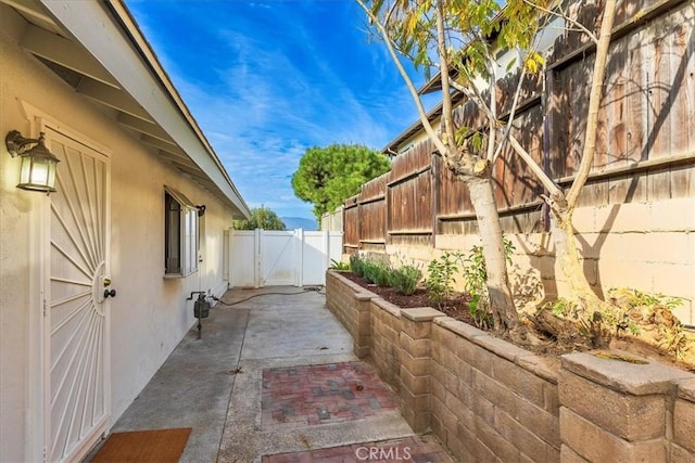 view of side of home featuring a patio