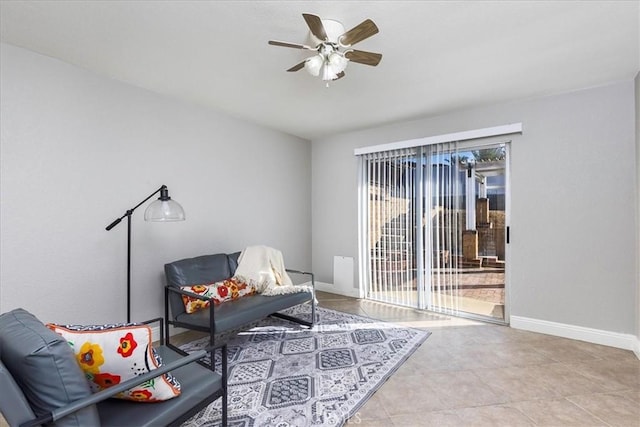 sitting room with light tile patterned flooring, ceiling fan, and a healthy amount of sunlight