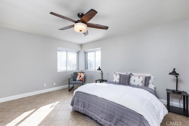 tiled bedroom with ceiling fan