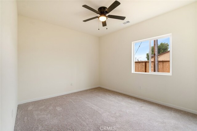 empty room with carpet and ceiling fan