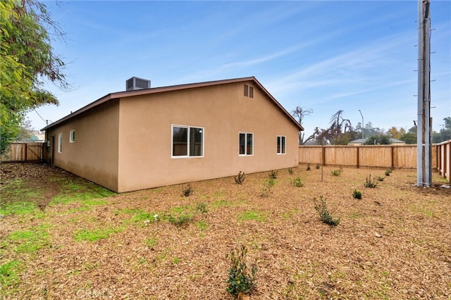 view of home's exterior with central AC unit