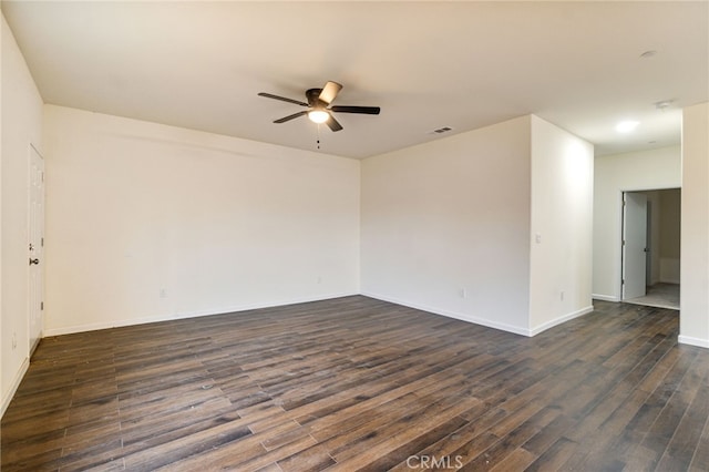 unfurnished room with ceiling fan and dark hardwood / wood-style floors