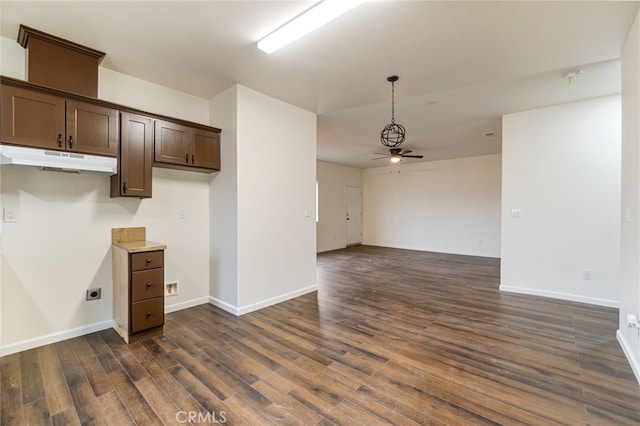 kitchen with dark brown cabinetry, dark hardwood / wood-style floors, and ceiling fan