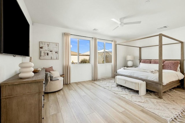 bedroom with ceiling fan and light hardwood / wood-style flooring