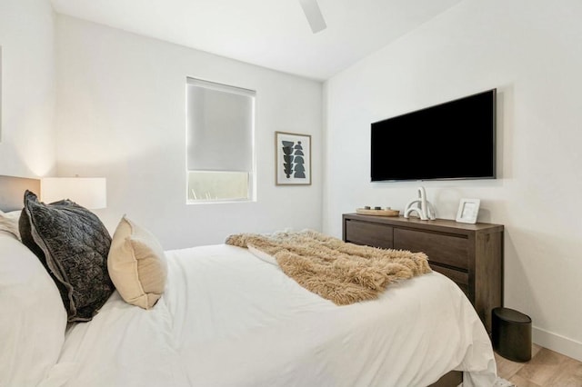 bedroom featuring ceiling fan and light hardwood / wood-style floors