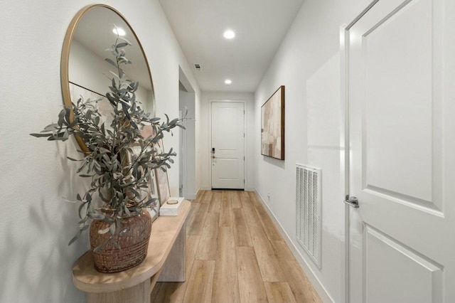 corridor with light wood-type flooring